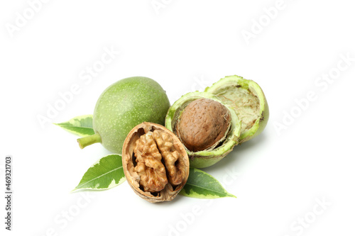 Walnuts with nut peel isolated on white background