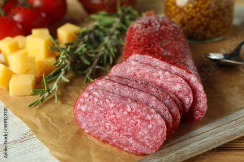 Сoncept of tasty food with salami sausage, close up