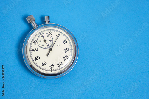 Stopwatch blue background.Doing sports and jogging.