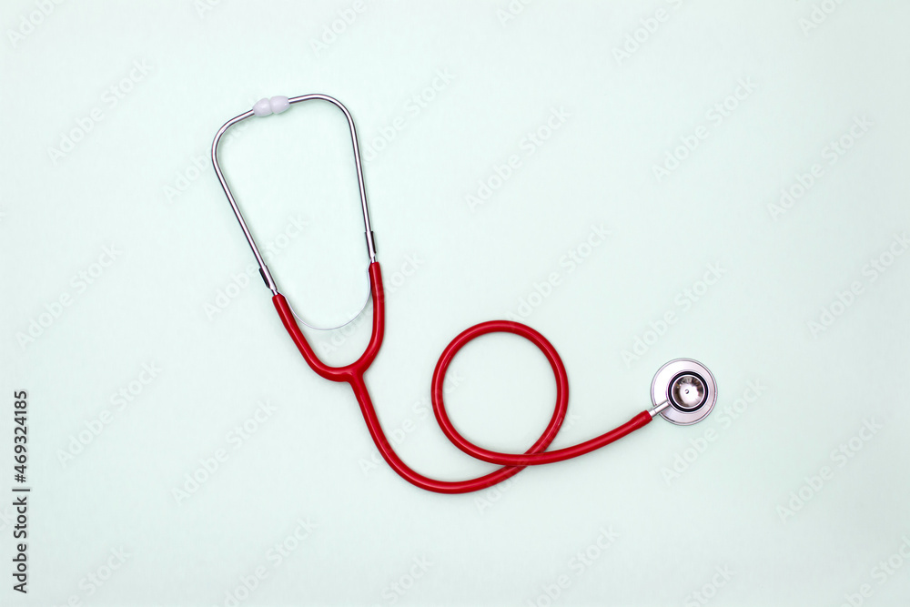 Stethoscope on green background top view. Medical tool Stethoscope on green background top view. Medical tool