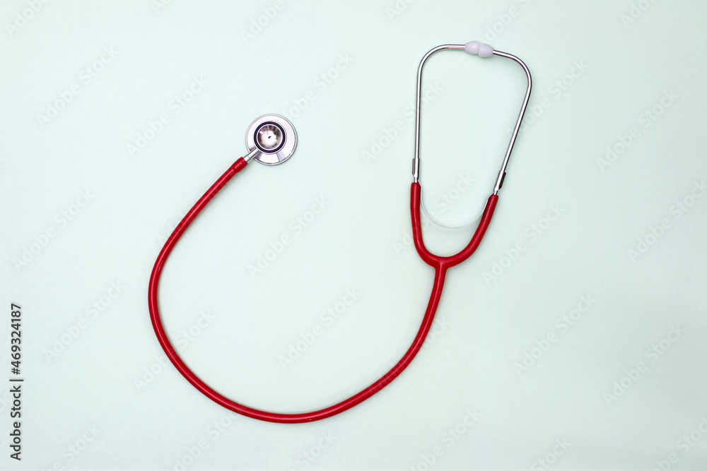 Stethoscope on green background top view. Medical tool Stethoscope on green background top view. Medical tool