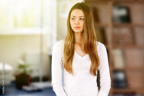 Joyless woman standing alone indoor. Tiredness, lack of optimism, solitude, life concerns concept Free Download Joyless woman standing alone indoor. Tiredness, lack of optimism, solitude, life concerns concept - GFXLoad