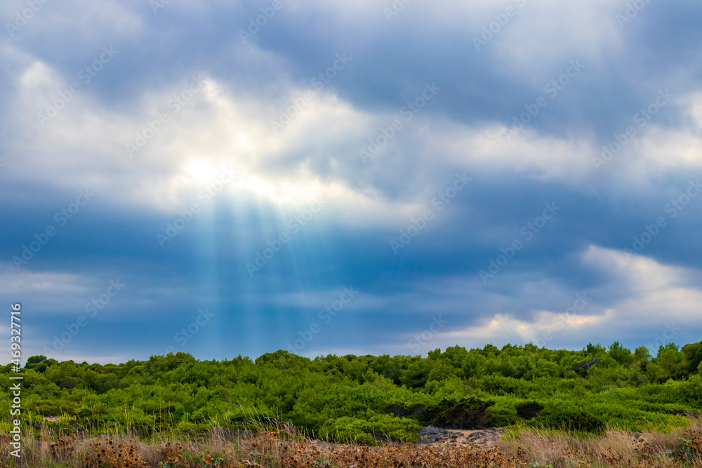 Obraz premium Sunbeams from the sky landscape panorama Can Picafort Mallorca Spain.