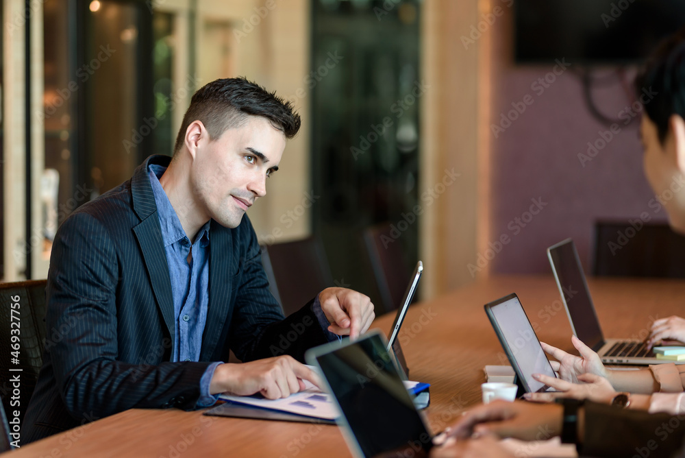 Businessman discussing financial reports at the meeting. Businessman discussing financial reports at the meeting.