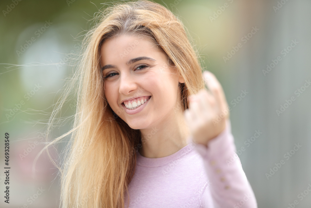 Happy teen gesturing come here in the street Happy teen gesturing come here in the street