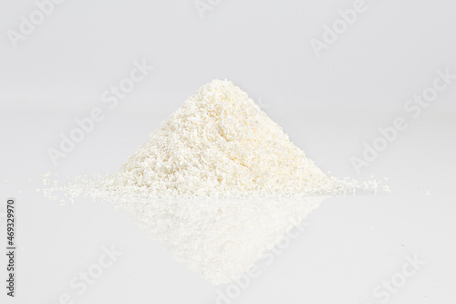 close up of grounded coconut flakes, coconut isolated on white background