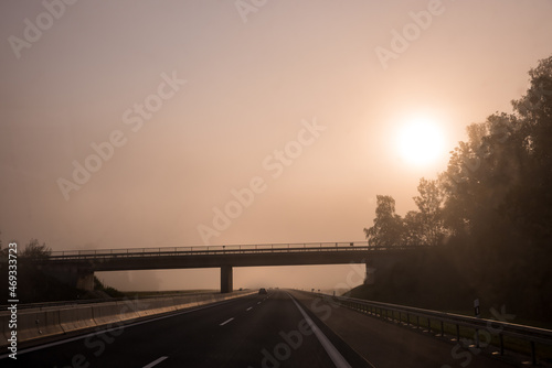 highway and bridge at foggy morning