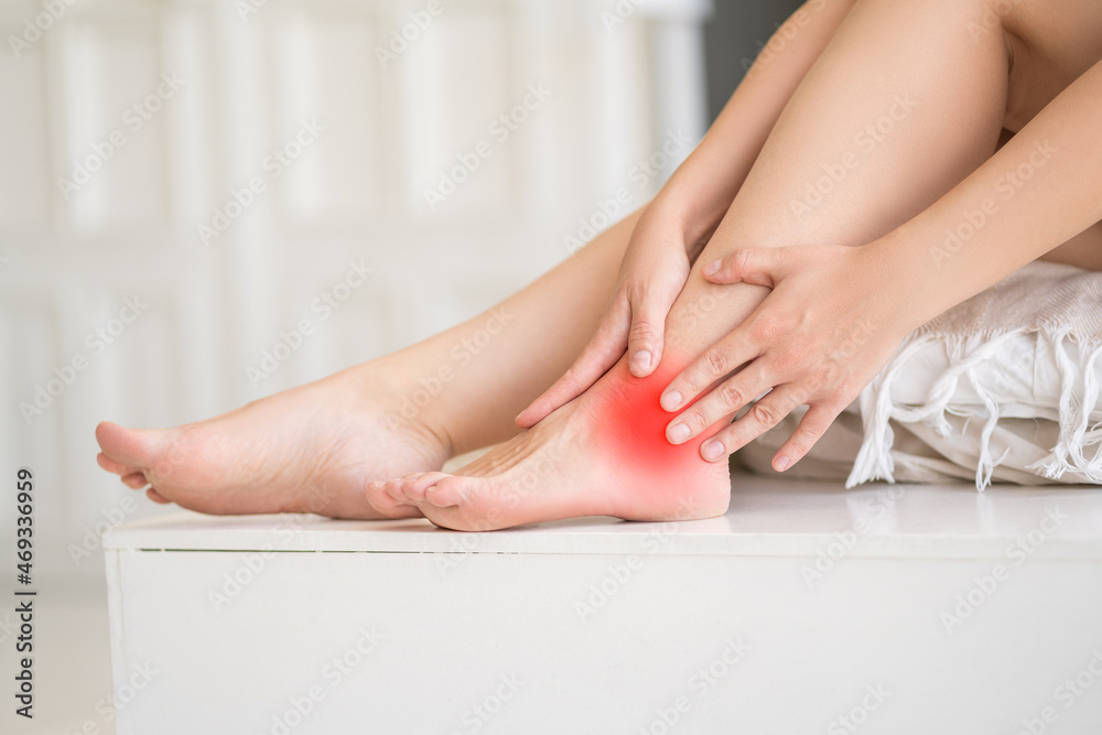 Ankle inflammation, pain in the foot, massage of female feet at home - obrazy, fototapety, plakaty 