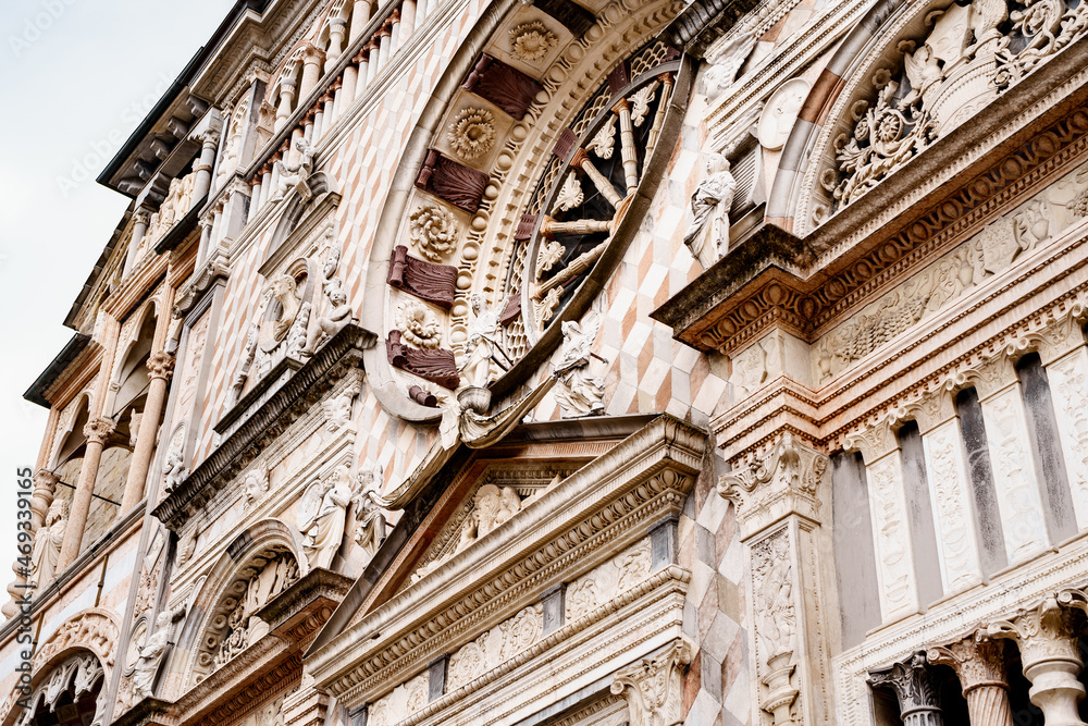 Statues Carved Molds Columns And Rose Window On The Facade Of The Statues Carved Molds Columns And Rose Window On The Facade Of The