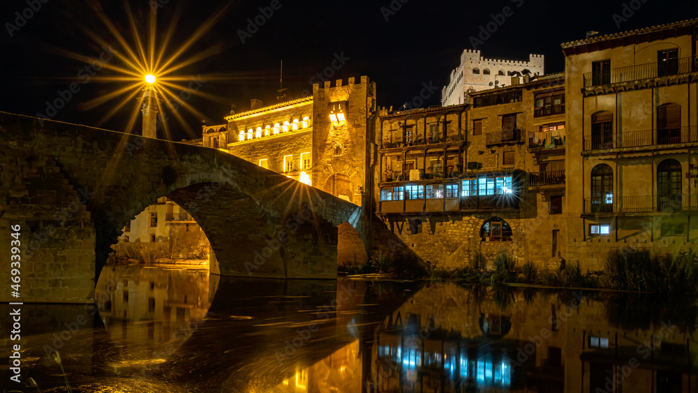 Night photography of the medieval bridge of Valderrobres at night, Matarraña, Teruel, Spain