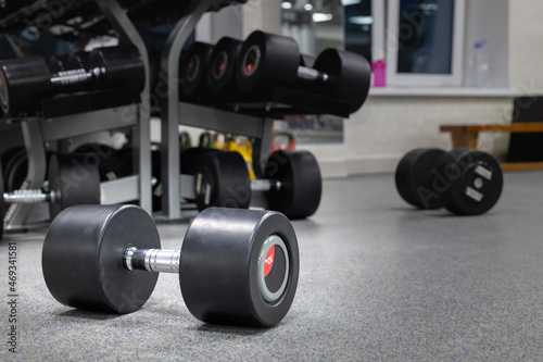dumbbells lying on the floor, after training in the hall © metelevan
