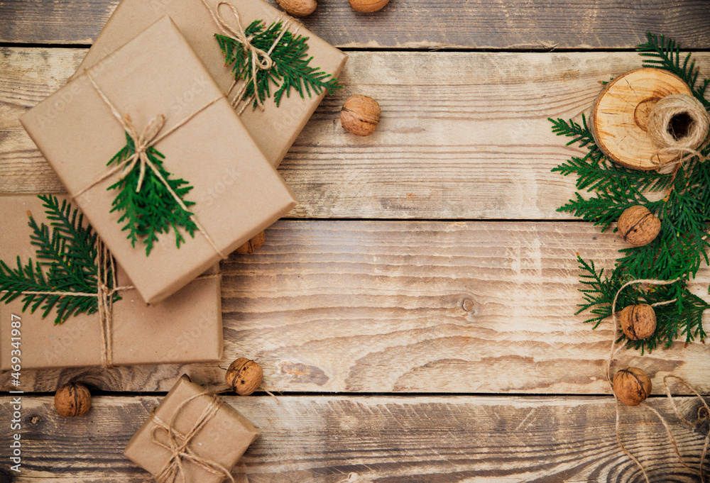 Boxes packed with kraft paper and natural twine on a wooden background. Delivery service.Eco-friendly material. Boxes packed with kraft paper and natural twine on a wooden background. Delivery service.Eco-friendly material.