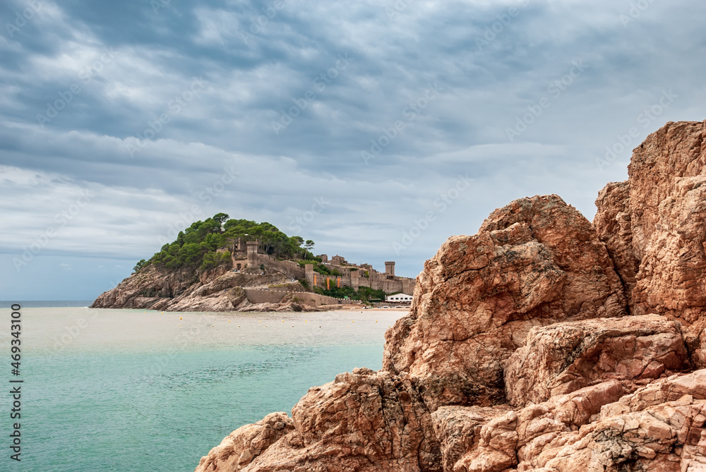 Fototapeta premium Tossa De Mar, Catalonia, Spain. A picturesque town with a fortress, with beautiful beaches and clean turquoise water in cozy bays near Barcelona. Famous tourist destination Costa Brava.