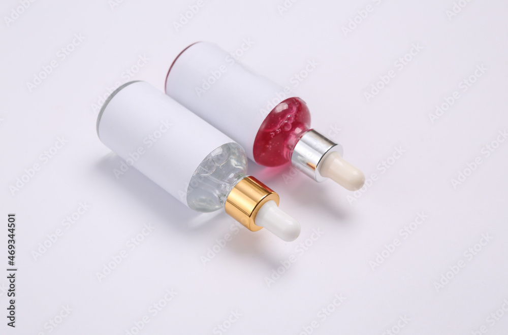 Mockup serum bottle on white background. Creative trendy beauty layout Mockup serum bottle on white background. Creative trendy beauty layout