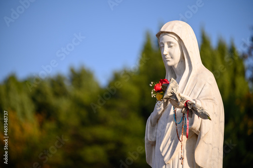 Statue of the Blessed Virgin Mary, the Queen of Peace, on Mount Podbrdo, the Apparition hill overlooking the village of Medjugorje in Bosnia and Herzegovina. 2021-11-07.  photo