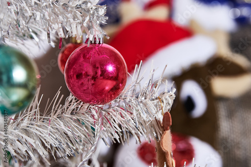 Christmas season, Christmas parties ,. Christmas tree with colored spheres and white luminous background. photo