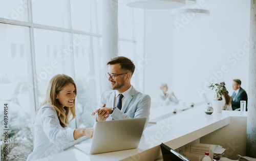 Young business couple worki...