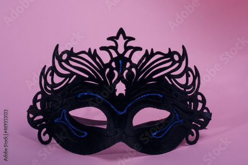 black venetian style carnival mask with bright blue lines
