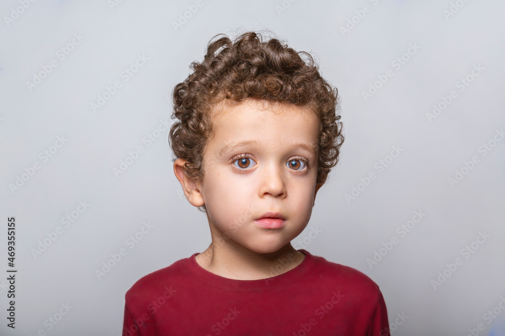 portrait of beautiful caucasian boy with curly hair portrait of beautiful caucasian boy with curly hair