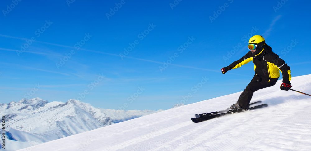 Skier in winter mountains