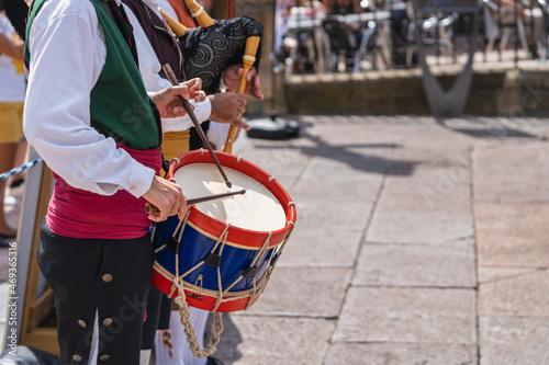 Man in Asturian costume playing the drum in a square in the city of Oviedo, Uvieu, in Asturias.