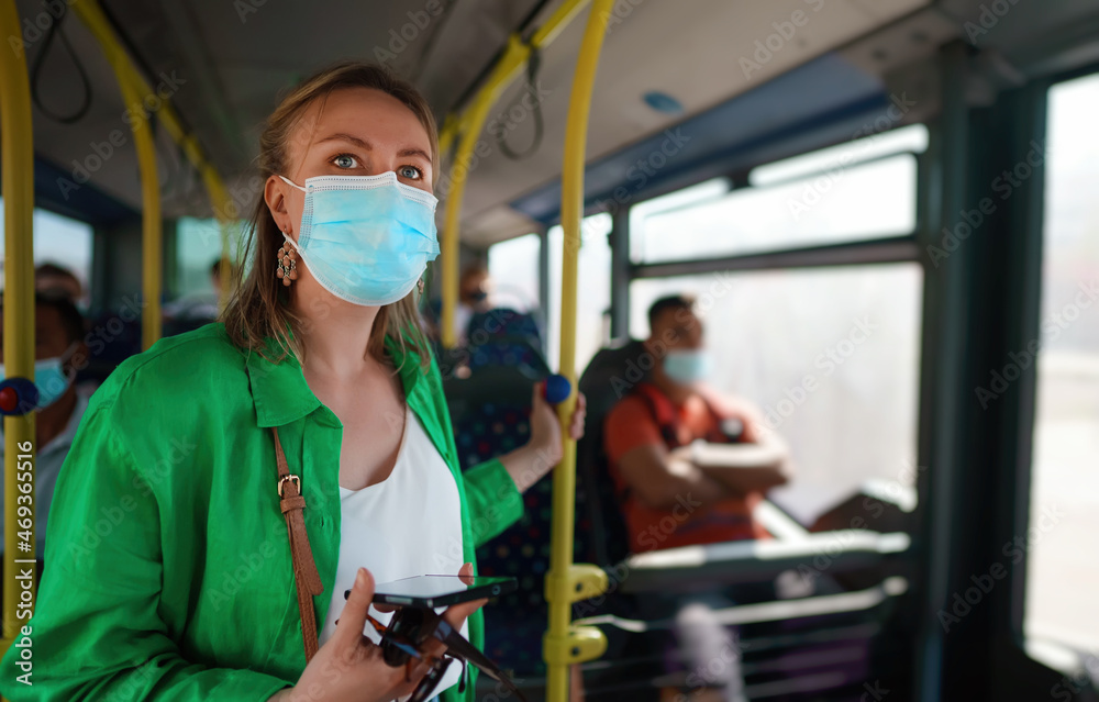 Woman in medical mask in the city bus. Woman in medical mask in the city bus.