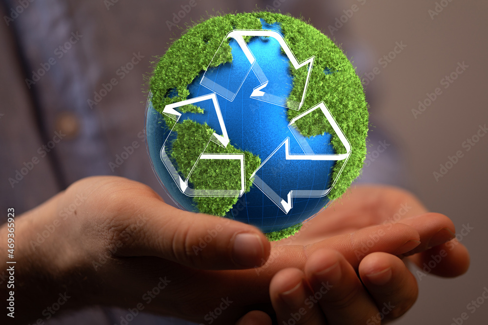 hand holding green recycle symbol hand holding green recycle symbol