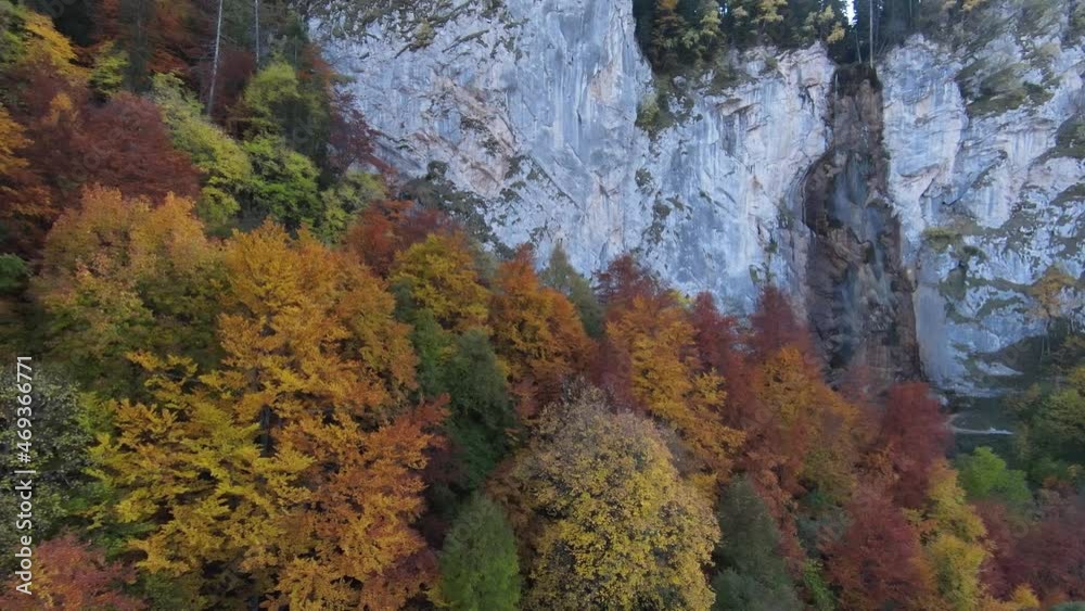 4K aerial view of autumn, waterfall, flying over forest in the autumn, big stones in the river, waterfall with big stones, blue sky 4K aerial view of autumn, waterfall, flying over forest in the autumn, big stones in the river, waterfall with big stones, blue sky