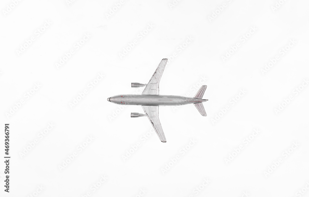 Obraz premium silver airplane model isolated on white background