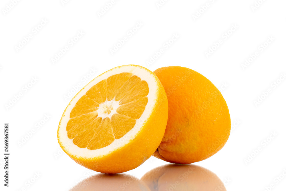 Two halves of a juicy bright yellow orange, close-up, isolated on white. Two halves of a juicy bright yellow orange, close-up, isolated on white.