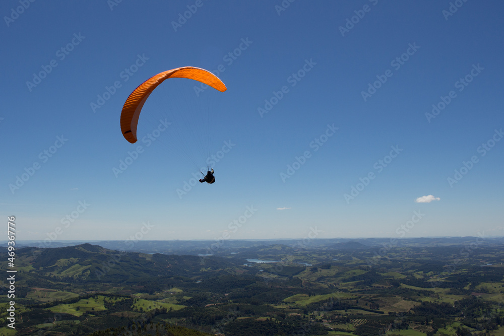 Paraglider in a beatiful day to fly. Clear and windy sky for sports. Flying over the mountains. Paraglider in a beatiful day to fly. Clear and windy sky for sports. Flying over the mountains.