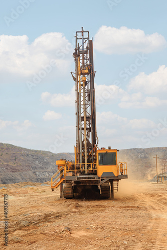 Machine for drilling wells in the quarry. Drilling of boreholes for laying an explosion in a quarry. Technologies of open-pit mining of minerals.