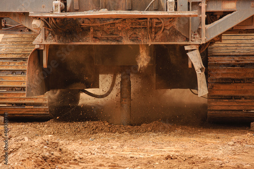 Preparation of a blast in an iron ore quarry, drilling wells with a drilling rig. Drilling in red rock. Technologies of iron ore mining