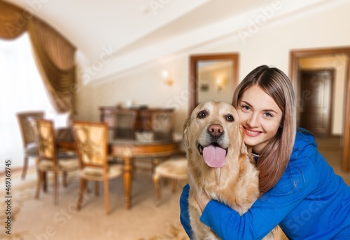 Wallpaper Mural Fluffy dog with its owner young woman, happy playing while staying home, Torontodigital.ca