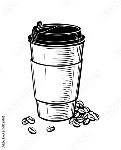 a paper cup with hot coffee and coffee beans lying nearby