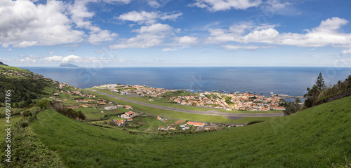 Panoramic view over the village of Santa Cruz das Flores, as the sky is clear it is possible to see the island of Corvo. From the viewpoint of Monte das Cruzes. Flores Island.
