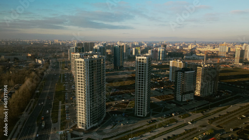 Construction site. Construction of modern multi-storey buildings. Against the background of the blue sky. Aerial photography. © f2014vad