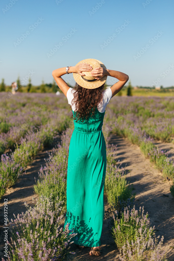 girl walks in the park along the lavender field