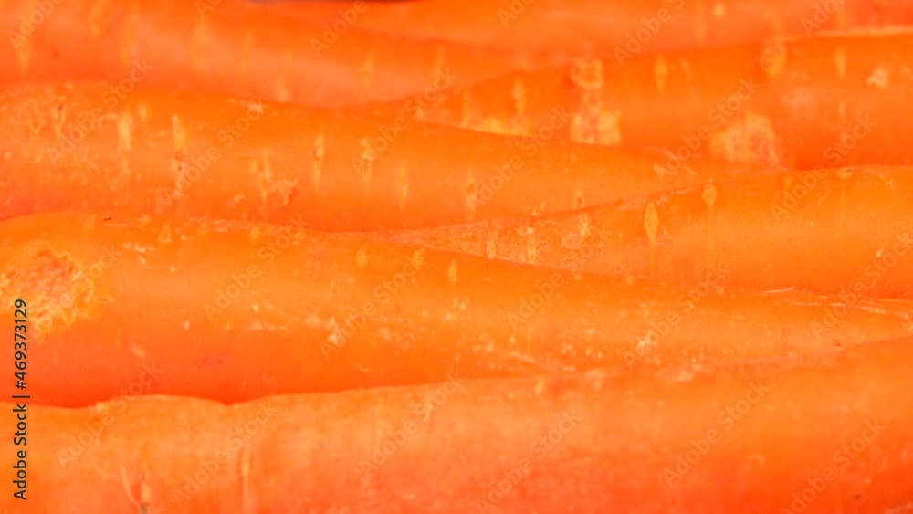 Closeup of fresh carrots lying on wooden table, France Closeup of fresh carrots lying on wooden table, France