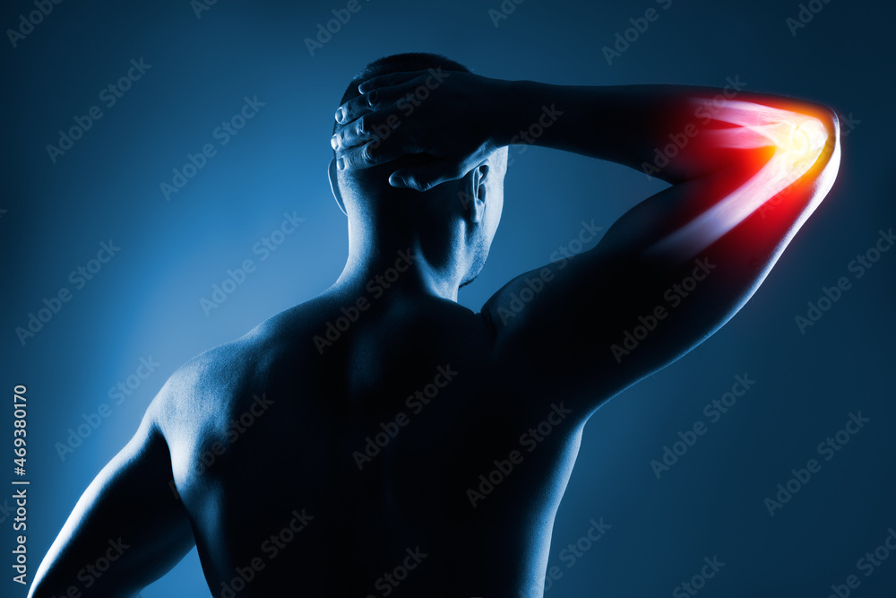 Fototapeta premium Human elbow joint in x-ray on blue background
