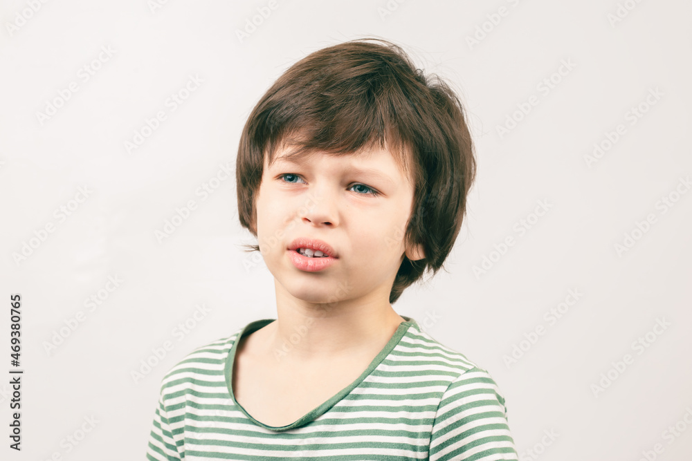 Portrait of Caucasian boy with unhappy bored face Portrait of Caucasian boy with unhappy bored face