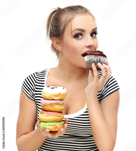 Funny girl  and colorful donuts.