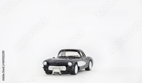 black retro toy car on a white background. Summer travel concept. buying  selling  insuring and renting cars