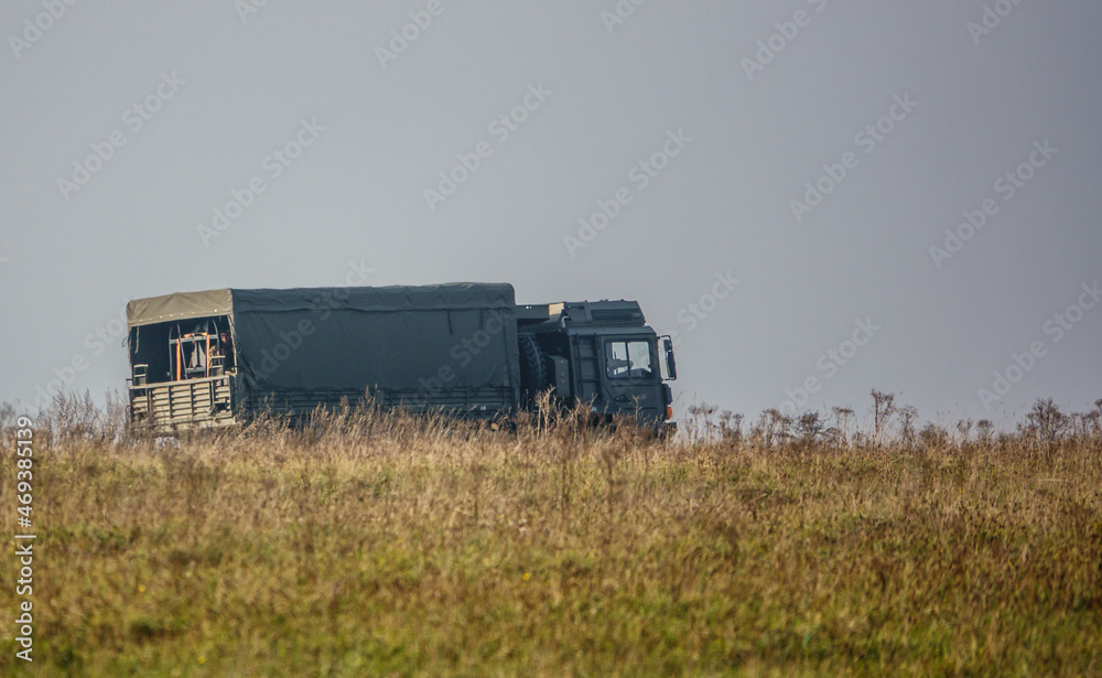 British army MAN SV 4x4 army logistics lorry vehicle truck driving along a dirt track in action on a military exercise, Salisbury Plain UK British army MAN SV 4x4 army logistics lorry vehicle truck driving along a dirt track in action on a military exercise, Salisbury Plain UK