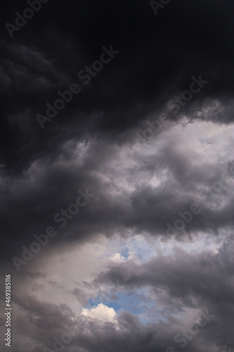 Epic dramatic Storm sky, dark grey and white cumulus clouds on blue sky background texture, thunderstorm