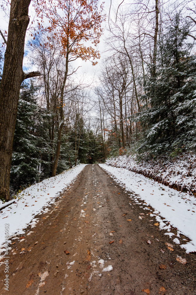 Snowy muddy winding country road Snowy muddy winding country road