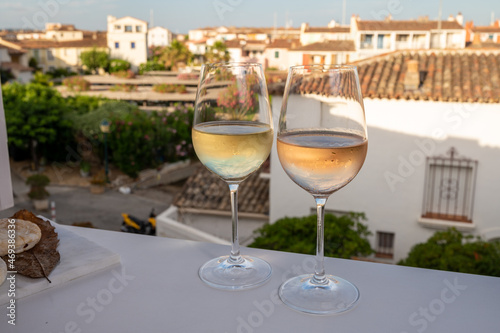 Summer on French Riviera Cote d Azur  drinking cold rose and white wine from Cotes de Provence on outdoor terrase in Port Grimaud  Var  France