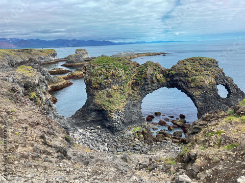 impressive archway on a beach in iceland, Gatklettur Basalt Rock in Arnarstapi