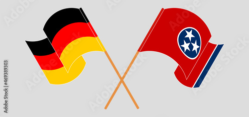 Crossed and waving flags of Germany and The State of Tennessee