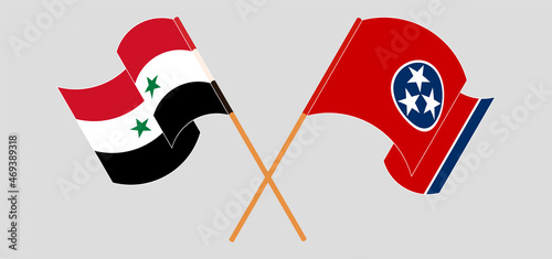 Crossed and waving flags of Syria and The State of Tennessee